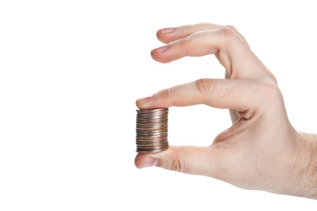 stack of coins in hand isolatedの写真素材