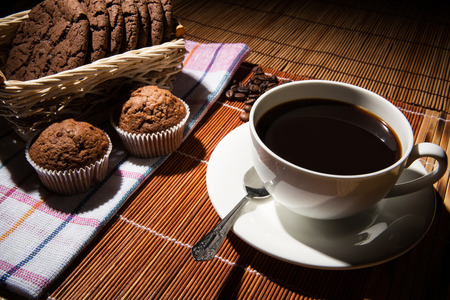 cup of black coffee and cookiesの写真素材