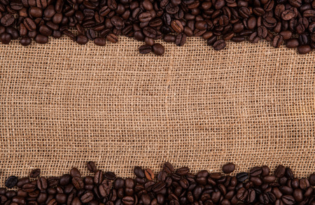 roasted coffee beans on a bag backgroundの写真素材