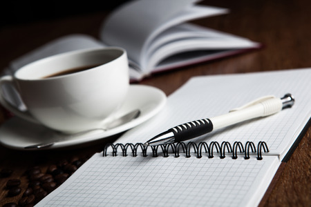 business still-life with cup of coffee and notepadの写真素材