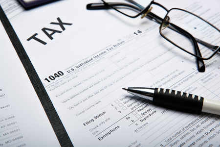 office work and filling in tax returns close upの写真素材