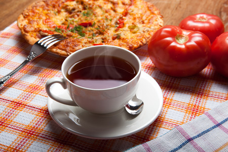 breakfast pizza and tea close upの写真素材