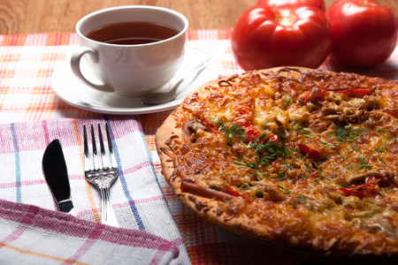 breakfast pizza and tea close upの写真素材