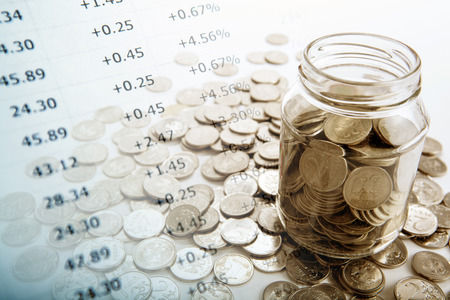 bank with coins and counting close upの写真素材