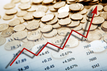 pile of coins with digits and diagram close upの写真素材