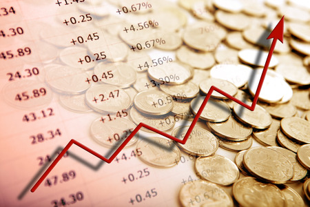 pile of coins with digits and diagram close upの写真素材