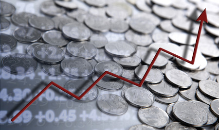 stacks of coins with diagram close upの写真素材