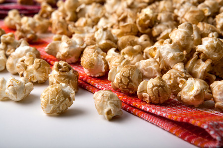 large caramel popcorn on a napkin close upの写真素材