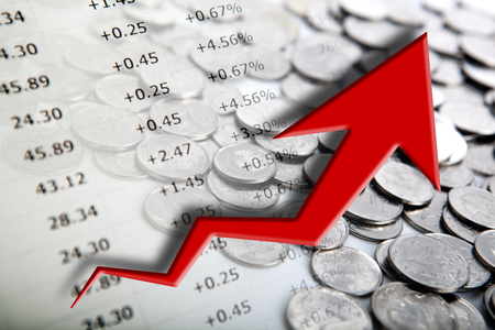 pile of coins with digits and diagram close upの写真素材