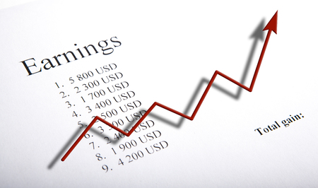 table with earnings with digits and diagram close upの写真素材