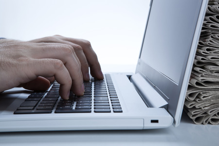 man is working at the computer looking for a jobの写真素材