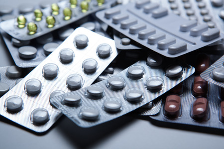 drugs pour into a pile on the table close up