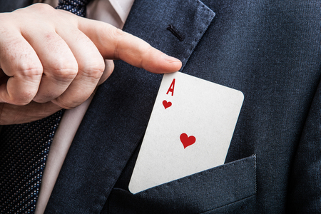 hand pulls the card ace of hearts close upの写真素材