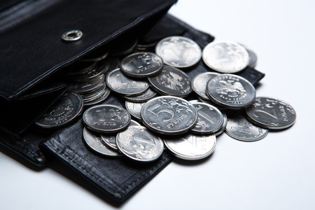 pocket purse with ruble coins on a white surface close upの写真素材
