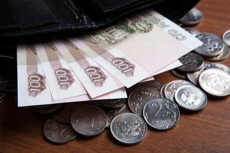 Russia's hundred-ruble banknotes and coins on the table  closeupの写真素材