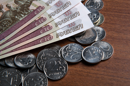 Russia's hundred-ruble banknotes and coins on the table  closeupの写真素材
