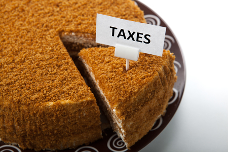 metaphor in the form of cake for the payment of taxes の写真素材