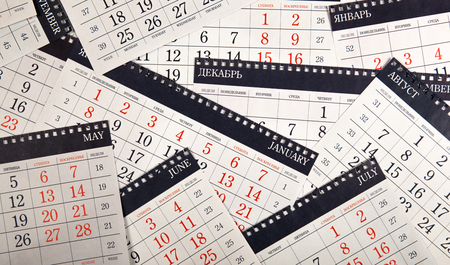 pile of wall calendar sheets on the table の写真素材