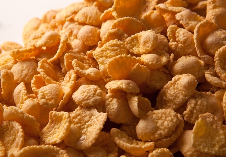 Pile of caramel cornflakes close up