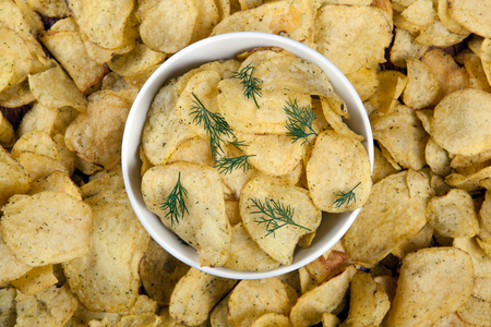 still life from a glass bowl with potato chips close upの写真素材