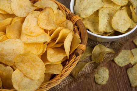 still life from a basket with potato chips close upの写真素材