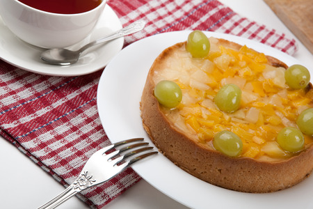 still life of freshly baked pie and cup of tea close upの写真素材