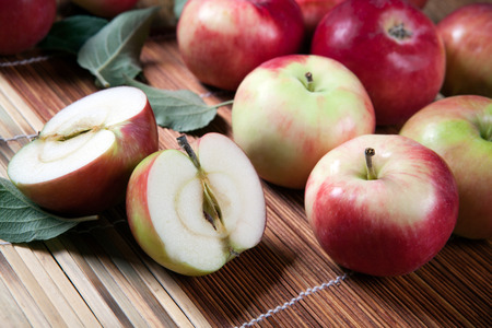 Still life of many apples on a bamboo napkin close upの写真素材