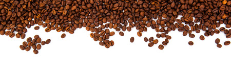 roasted coffee beans on a white background close upの写真素材