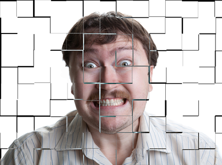 portrait of a man with an emotional expression on a white backgroundの写真素材