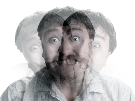 portrait of a man with an emotional expression on a white backgroundの写真素材