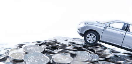 piles of Russian ruble coins and a car model backgroundの写真素材