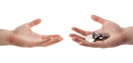 Russian ruble coins in the palm of a person who hands over to another hand isolatedの写真素材