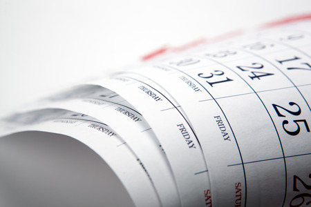 pile of printed wall calendar sheets closeupの写真素材