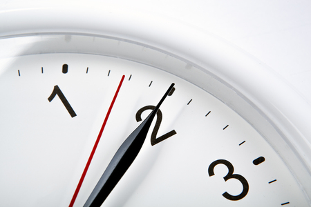 clock face on a white table closeupの写真素材