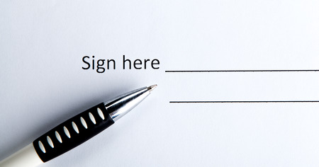 One contract with a place for a signature and a pen closeupの写真素材