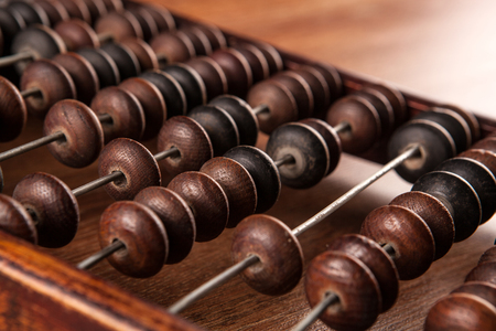 big antique abacus on a wooden table close upの写真素材