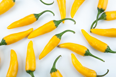 fruits of golden fresh chilli pepper on a white background still life top viewの写真素材
