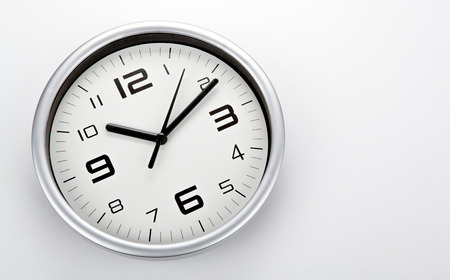 white clock face with black digits on a white background