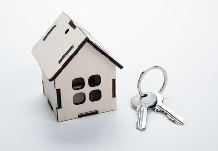 wooden miniature house with door keys close upの写真素材