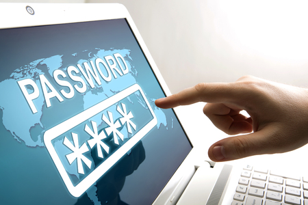 human fingers on the notebook screen and network authorizationの写真素材