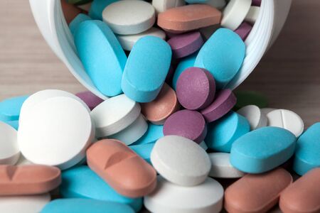large bunch of colored medical pills close upの写真素材