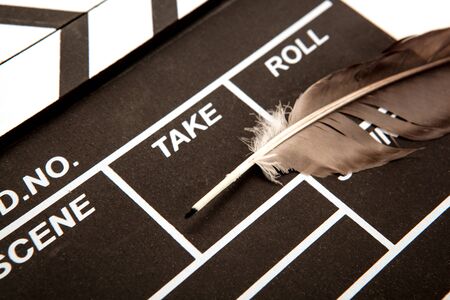 black movie clapper and fountain pen closeupの写真素材