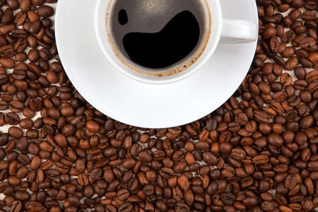 cup of black coffee with roasted coffee beansの写真素材