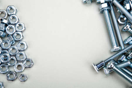 steel nuts screws fastening materials a lot closeupの写真素材