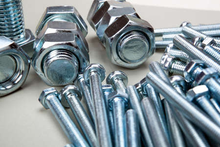 steel nuts screws fastening materials a lot closeupの写真素材