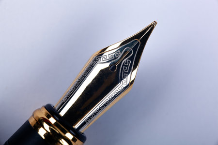 gold plated fountain pen closeup on the tableの写真素材