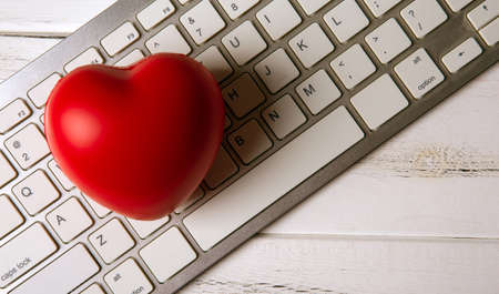 red heart on pc keyboard of notebook websiteの写真素材