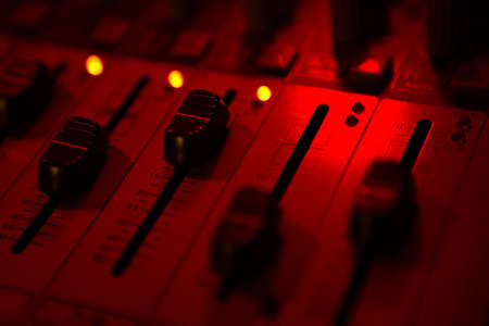 sound mixer and faders close up DJ disco musicの写真素材