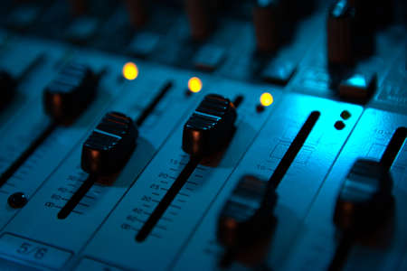 sound mixer and faders close up DJ disco musicの写真素材