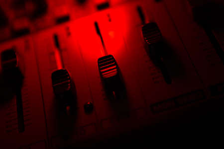 sound mixer and faders close up DJ disco musicの写真素材